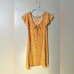 Yellow/orangey dress with white flowers